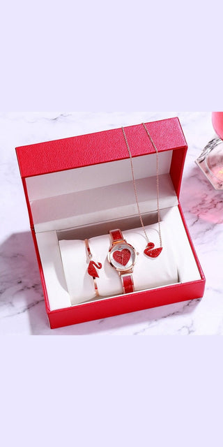 Red leather jewelry gift set showcasing a luxurious ladies watch and matching accessories on a marble background