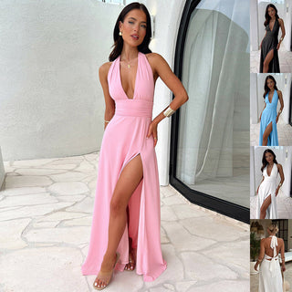 Elegant pink halter dress with deep v-neck, high slit, and backless design - stylish summer fashion for confident women.