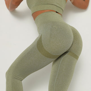 Sleek olive green yoga leggings with curve-enhancing design, perfect for active lifestyles.