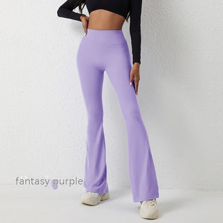High-waisted flared women's yoga pants in a vibrant purple color, showcased on a model in a studio setting.