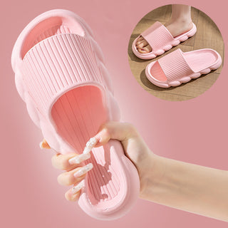 Soft pink women's home slippers with non-slip wave bottom design for comfortable bathroom use
