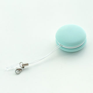 Mint-colored macaron-shaped keychain screen cleaner on plain background