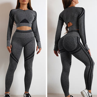 Stylish seamless grey workout leggings and crop top outfit with cutout details, showcasing a fashionable and functional athletic ensemble.