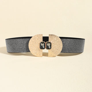 Stylish women's belt with striped elastic waistband and decorative circular metal and pearl elements.