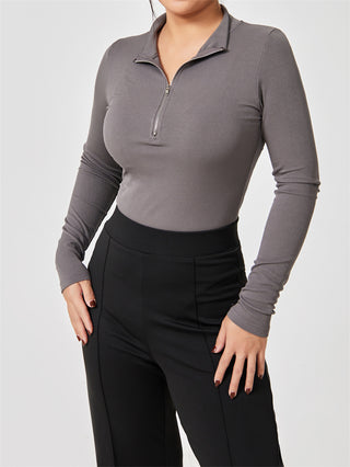 Stylish long sleeve gray bodysuit with zip-up neckline for a sleek, modern look.