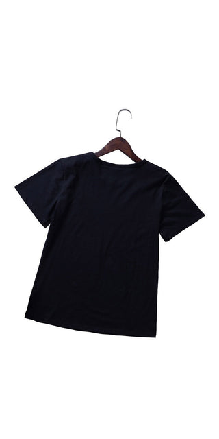Stylish black women's t-shirt with a simple design, displayed on a wooden hanger against a clean white background.