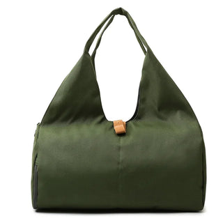 Olive green VentureFlex duffle bag with yoga accessories, fitness training gear, and a spacious shoe pocket for a women's weekend travel or swimming needs.