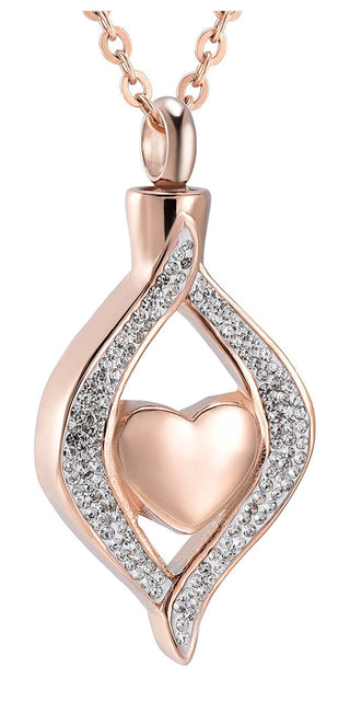 Elegant titanium steel heart-shaped pendant with sparkling cubic zirconia accents, suspended on a chic rose gold-tone chain. This stylish jewelry piece from K-AROLE effortlessly complements women's athleisure outfits, adding a touch of sophistication to elevate your fashionable look.