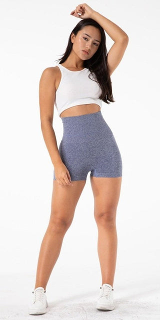Comfortable grey athletic shorts for athleisure wear, paired with a white crop top for a stylish, active look.