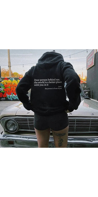 Cozy black unisex hoodie with inspiring message on the back, featuring a kangaroo pocket and drawstring for a comfortable, trendy look.
