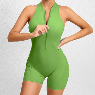 Green halter-style sporty jumpsuit with zipper front closure, designed for women's fitness and yoga activities.