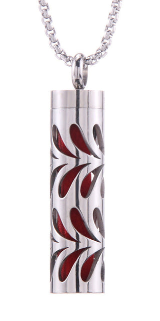 Stainless Steel Aromatherapy Pendant with Floral Design. Stylish cylinder-shaped necklace with intricate floral etched pattern, perfect for holding essential oils and elevating your daily style.