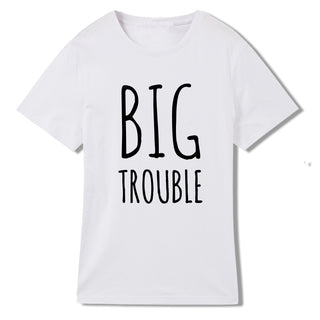 Casual white t-shirt with bold black text that reads "BIG TROUBLE" printed on the front.