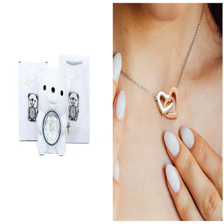 Rotating Eternal Flower Ring Necklace Packaging Box - Elegant heart-shaped necklace on female model's neck, showcasing the stylish jewelry accessory.