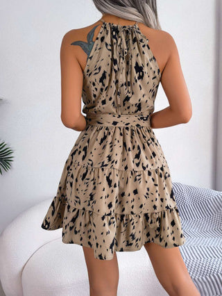 Stylish leopard print ruffled dress with cinched waist and flowy skirt for a chic summer look.