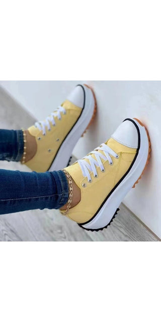 Stylish yellow canvas sneakers with white laces and soles, showcasing a modern, trendy design for fashionable footwear.