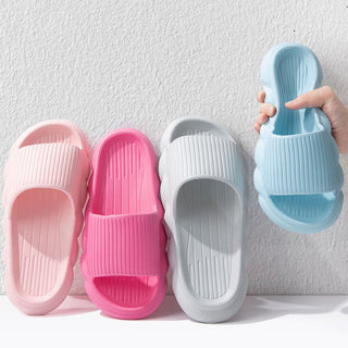 Soft and Stylish Wave Bottom Women's Slippers - Pastel-colored, non-slip bathroom shoes with a comfortable ribbed design.