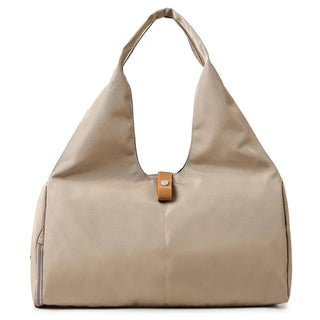 Beige leather handbag with strap and hardware details, suitable for fitness training, travel, and everyday use.