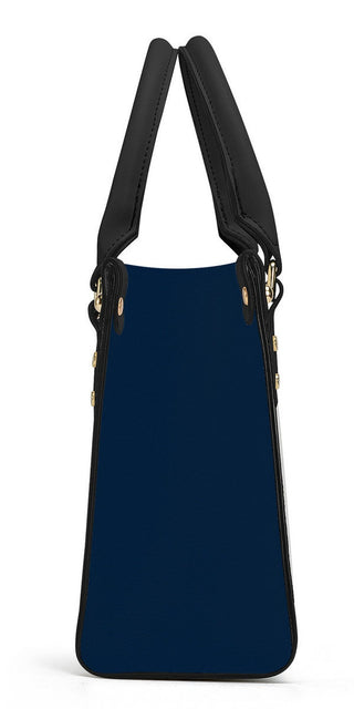 Elegant navy blue tote bag from K-AROLE featuring sleek black leather straps and accents for a stylish and versatile look.