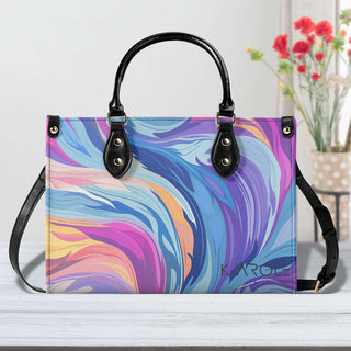 Vibrant, swirling colors in a stylish, modern handbag - the Starry Moon Handbag from K-AROLE's collection. This eye-catching accessory features a striking marble-like pattern in shades of blue, purple, and orange, perfect for elevating your women's athleisure outfits.