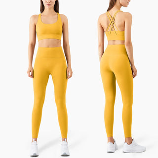Vibrant yellow sports bra and high-waisted leggings from K-AROLE™️ sportswear collection. Comfortable and stylish athletic wear ideal for fitness activities.