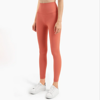 Vibrant Fitness Leggings K-AROLE™️: High-waist, skin-tight coral athletic leggings on a female model against a white background.