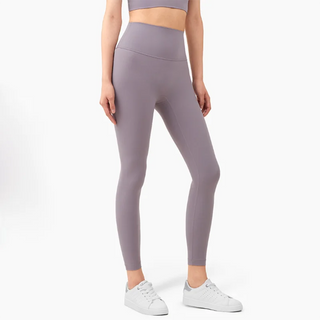 Sophisticated performance leggings in a sleek gray shade displayed against a plain background, showcasing the modern, athleisure-inspired design perfect for an active lifestyle. The high-waist silhouette and seamless construction provide a flattering, comfortable fit for any fitness routine.