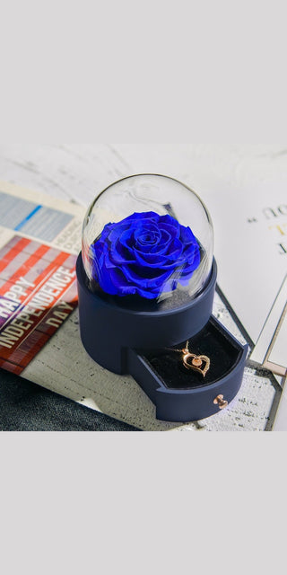 Elegant blue rose displayed in glass dome on business documents, perfect gift for birthdays and Valentine's Day from K-AROLE.