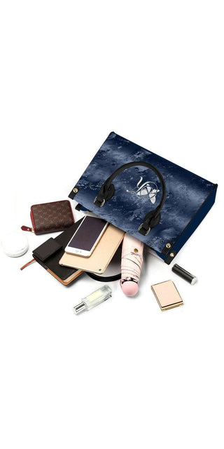 Stylish blue tote bag showcasing a variety of cosmetic products from the K-AROLE brand. This versatile accessory is perfect for organizing and carrying your makeup essentials while adding a touch of trendy elegance to your athleisure outfits.
