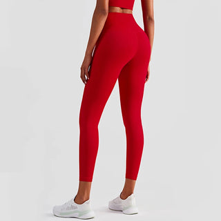 Vibrant red fitness leggings from K-AROLE™️. High-waisted, form-fitting design for an active lifestyle. Stylish and comfortable athletic wear.