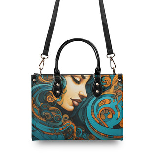 Elegant urban satchel featuring a vibrant, artistic portrait of a woman with intricate swirling patterns in shades of teal, orange, and beige. The stylish handbag showcases K-AROLE's distinctive design flair and high-quality craftsmanship.