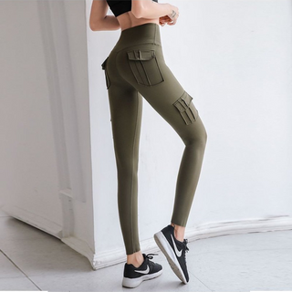 Olive-green women's cargo leggings with pockets, showcased on a person's lower body against a white background.