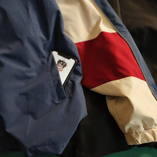 Retro color-blocked baseball jacket with patchwork design and shiny silver zipper detail