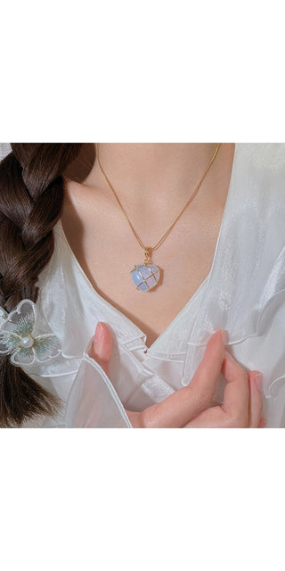 Elegant moonstone pendant necklace for fashionable women's style. Whimsical heart-shaped jewel with intricate crystal design. Versatile accessory to elevate any casual or formal outfit. Trendy women's jewelry from K-AROLE collection.