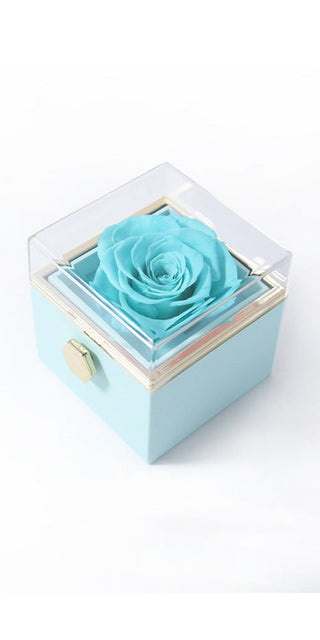 Elegant blue rose in glass box: Preserved turquoise rose in modern acrylic display, a romantic proposal or Valentine's Day gift.