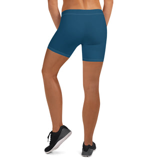 Comfortable, stretchy athletic shorts in deep blue color, showcasing the legs of a person against a plain background.