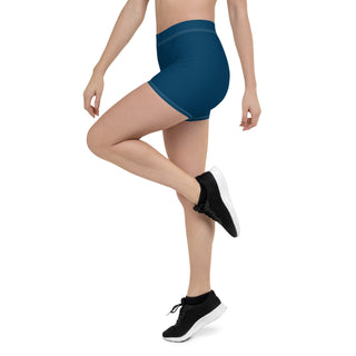 Stylish athletic shorts in a vibrant blue color, showcasing a sleek and modern design for active wear. The image features a female model's lower body posing athletically, highlighting the versatility and comfort of the versatile shorts.