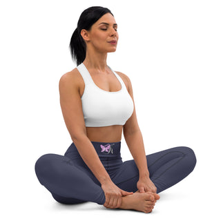 Comfortable yoga leggings with butterfly graphic, worn by a woman with long dark hair practicing yoga on a white background.