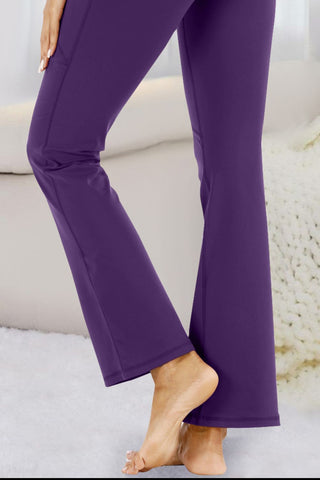 Stylish purple flared yoga pants with a comfortable and flattering fit, perfect for your workout or casual wear.