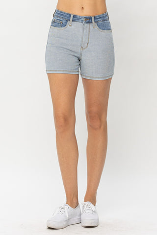 High-waisted denim shorts in a light blue heather tone, featuring a classic 5-pocket design and a belt loop waistband.