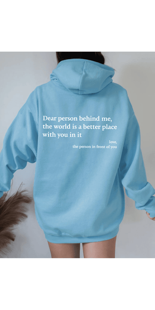 Trendy light blue hoodie with a heartwarming message printed on the back: "Dear person behind me, the world is a better place with you in it - the person in front of you".