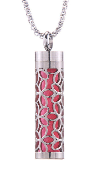 Elegant Aroma Diffuser Necklace: Stainless steel cylinder pendant with intricate floral design, holds essential oils for a personalized fragrance experience.
