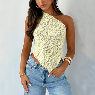 Elegant lace one-shoulder summer top in a vibrant yellow hue, paired with stylish blue denim jeans, creating a chic streetwear look.