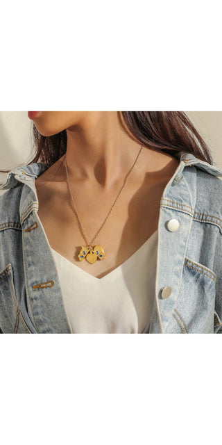 Elegant butterfly heart pendant necklace on female model wearing denim jacket in K-AROLE product image
