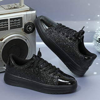 Stylish black sneakers with glittery sequin design. Trendy casual fashion shoes with a thick sole and lace-up closure, perfect for a street-style look.