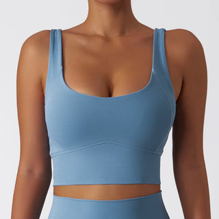 Stylish blue sports bra with a comfortable and flattering fit, ideal for yoga, fitness, or any active lifestyle.