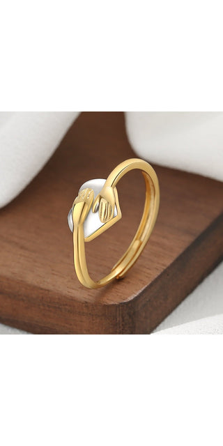 Elegant heart-shaped gold ring with simple design for stylish Valentine's Day look.