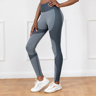 Stylish grey seamless yoga leggings with high waist design, featuring a flattering fit and stretchy fabric for comfortable, active wear.
