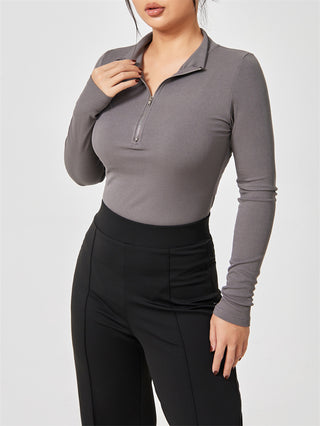 Fashion long sleeve seamless slimming jumpsuit for women featured on a gray background.