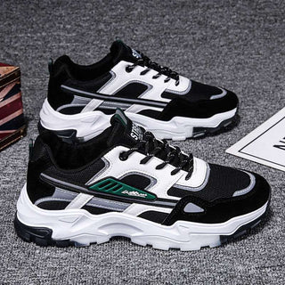 Sleek Monochrome Sneakers - Stylish black and white athletic shoes with a bold, modern design. Ideal for sporty and casual wear.